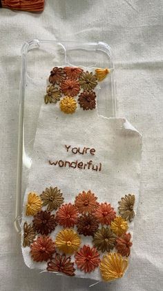 a cell phone case with flowers and the words you're wonderful written on it