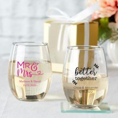 two wine glasses sitting next to each other on a table