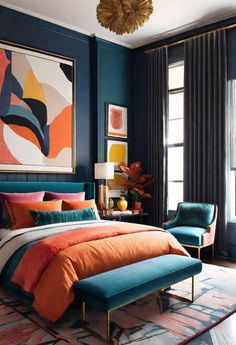 a bedroom with blue walls, orange bedding and an art work on the wall