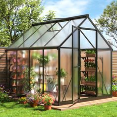 a green house with potted plants in it