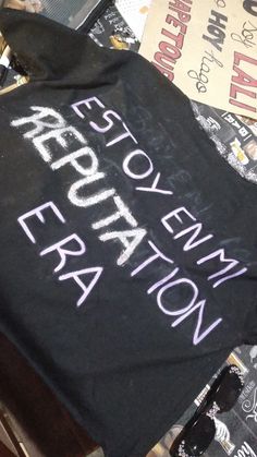 there is a black shirt with white writing on it that says, revolution new york