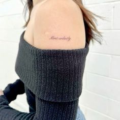 a woman with a tattoo on her shoulder that says, love is simply written in cursive font