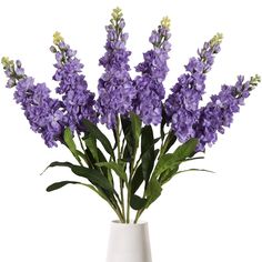 a white vase with purple flowers in it