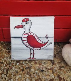 a painting of a duck on a red painted wall