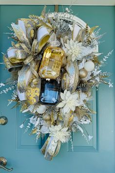 a blue door with a gold and white wreath on it