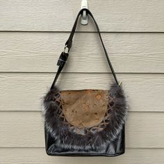 “THE FIND” FAUX LEATHER FUR COW SKIN HANDBAG SHOULDER BAG. Condition is gently used. The only flaw is peeling by the ring area (see last picture) Brown Faux Fur Lined Shoulder Bag For Shopping, Brown Leather Bag With Faux Fur Lining, Leather Bag With Faux Fur Lining, Brown Shoulder Bag With Faux Fur Lining For Shopping, Faux Fur Lined Shoulder Bag, Daily Use Faux Fur Shoulder Bag, Faux Fur Shoulder Bag For Daily Use, Faux Fur Tote Shoulder Bag, Winter Leather Shoulder Bag With Faux Fur Lining