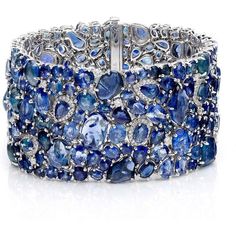 The Enchanted Evening Celeste Bracelet by Ruchi New York is a piece of fine jewelry that is sure to catch the eye of any woman looking for a unique and luxurious accessory. This stunning cuff bracelet is handcrafted with organic shapes of sapphire nuggets mixed with varying shades of faceted sapphires. The result is a one-of-a-kind piece that exudes sophistication and glamour. With 123.38 carats of blue sapphires and 1.64 carats of diamonds, this bracelet is truly a statement piece that will be Elegant Multi-stone Cuff Bangle Bracelet, Luxury Sapphire Bracelet Jewelry, Unique Formal Gemstone Bangle, Fine Sapphire Bangle Jewelry, Unique Formal Bangle With Gemstone, Luxury Sapphire Bangle Jewelry, Luxury Sapphire Bangle Bracelet, Unique Gemstone Bangle For Formal Occasions, Luxury Sapphire Bangle Bracelets