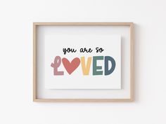 a framed print with the words you are so loved