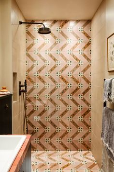 a bathroom with a tiled shower and sink