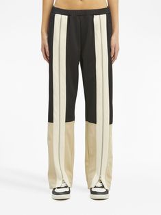 zip-detailing striped trousers from PALM ANGELS featuring butter yellow, black, two-tone design, decorative zip detailing, elasticated waistband, low-rise, straight leg, two side inset pockets and straight hem. Size Info STANDARD Color Detail Black Made In Italy Material 100% polyester Season One Fall-Winter Season Two Fall-Winter Product trousers Brand Palm Angels Size And Fit This piece fits true to size. We recommend you get your regular sizeModel is 1,75m / 5ft 8in wearing size S Trench Dress, Butter Yellow, Cape Coat, Palm Angels, Knitwear Cardigan, Pant Shirt, Zipper Detail, Womens Sweatpants, Signature Style