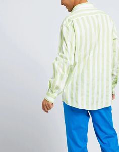 Maxi-striped shirt crafted from breathable 100% cotton canvas, ideal for warm weather. Long sleeves and collar provide coverage while placket details add polish. Bold color stripes make a statement without overpowering. Versatile cut fits comfortably for daily activities or relaxed looks. Wear with jeans or slacks equally; take anywhere from work to weekend. Timeless style enhances any outfit with vibrant pop. Quality Italian construction ensures long lasting wear and washability. Spring Yarn-dyed Collared Shirt, Striped Shirt With Button Closure For Spring, Spring Striped Shirt With Button Closure, Striped Long Sleeve Shirt For Spring, Spring Long Sleeve Shirt With Striped Collar, Casual Green Shirt With Vertical Stripes, Casual Long Sleeve Shirt With Vertical Stripes, Oversized Long Sleeve Shirt With Striped Collar, Green Spread Collar Shirt For Spring