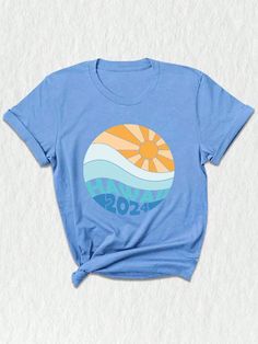 Welcome the summer of 2024 with our exclusive Hawaii 2024 Shirt! This versatile piece is your ultimate companion for sun-soaked days and breezy nights. Crafted from premium, breathable cotton, it ensures you stay comfortable and cool whether you're exploring the city, lounging on the beach, or embarking on a memorable summer trip. Available in a range of sizes from XS to XXL, this shirt offers a flattering fit for everyone, making it a perfect addition to your family vacation wardrobe. The vibra Hawaii Family Vacation Shirts, Blue Summer Shirt For Beach Season, Blue Summer Camp Shirt For Vacation, Summer Blue Camp Shirt For Vacation, Blue Camp Shirt For Beach Vacation, Summer Vacation Blue Camp Shirt, Blue Graphic Print Shirt For Vacation, Summer Style Shirt For Beach Party In Spring, Blue Summer Shirt For Vacation