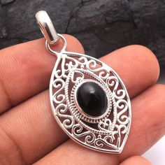 "Black Onyx Pendant, Designer Pendant, Boho Jewelry, Crystal Healing, Multi Stone, Handmade Jewelry, Gift For Her   METAL - 925 STERLING SILVER GEMSTONE - Black Onyx, Larimar, Labradorite, Moonstone,Citrine, Ethiopian Opal, Green Onyx PENDANT LENGTH - 1.7\"  PENDANT WEIGHT - 5.5 GRAMS STONE SIZE - 10 x 8 MM STONE SHAPE - Oval COLOR - Black Benefits of wearing Silver: silver has significant health benefits that have been used across cultures for centuries. Silver has a proven track record as a powerful antimicrobial agent fighting infections and aiding in cold and flu prevention, wound healing, and more. Silver also helps with internal heat regulation and circulation. Occasion :   Birthday gift, Valentine's Day Gift, Anniversary Gift, Wedding Gift, Engagement Gift, Christmas Gift For Her , Lapis Lazuli Pendant, Pretty Pendant, Handmade Fine Jewelry, Sterling Silver Jewelry Handmade, Rose Quartz Gemstone, Filigree Design, Silver Jewelry Pendant, Silver Jewelry Handmade, Green Onyx