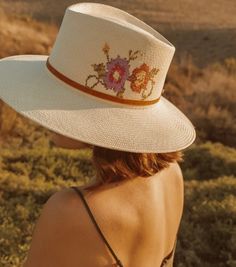 An elegant straw hat with hand embroidered flowers cross-stitched, finished with a narrow velvet ribbon 9cm brim Hand Woven Panama Hat from Paja Toquilla straw Each hat is unique and reflects the natural beauty & variation of the handicraft process Small/Medium (55 cm - 57 cm), Large (58-59 cm) Affordable White Embroidered Hat, Artisan Woven Straw Hat For Spring, Artisan Brimmed Sun Hat For Spring, Artisan Woven Panama Hat For Spring, Spring Handmade Panama Hat In Toquilla Straw, Handmade Toquilla Straw Panama Hat For Spring, Artisan Flat Brim Sun Hat For Spring, Handwoven Artisan Hat For Spring, Artisan Brimmed Panama Hat For Spring