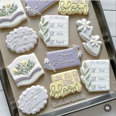 decorated cookies are displayed on a tray with writing and flowers in them, including thank you mom