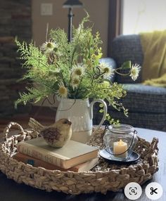 a tray with flowers and books on it