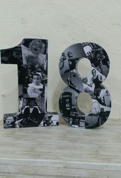 the number eight is made out of photos and has been placed on top of a shelf