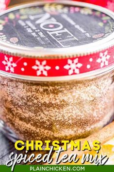 christmas spiced tea mix in a glass jar with cinnamon on the side and text overlay that reads, christmas spiced tea mix