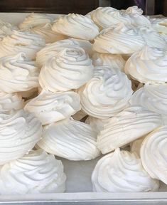 white frosted cupcakes in a box ready to be eaten