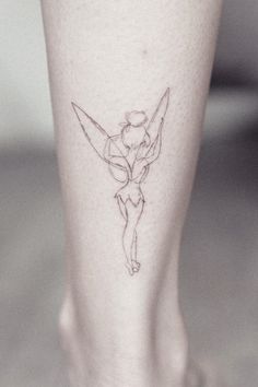 a small tattoo on the leg of a woman