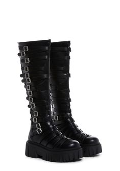 in a vegan leather construction. These knee high boots have decorative buckles on both sides, treaded soles, and back zipper closures. Thigh High Purple Boots, Alternative Style Moto Boots With Buckle Closure For Fall, Gothic Leather Knee-high Boots, Gothic Leather Knee-high Boots For Alternative Fashion, Alternative Style Knee-high Moto Boots For Fall, Edgy Knee-high Boots With Buckle Closure, Fall Moto Boots With Buckle Closure For Alternative Fashion, Fall Season Knee-high Boots For Alternative Fashion, Black Punk Knee-high Boots With Buckle