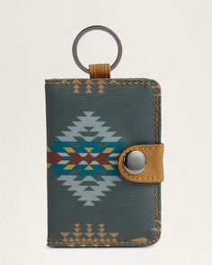 A compact wallet with attached key ring, featuring an interior ID window and card slots. Secures with a snap closure. Durable, wipe-clean polyester. Pattern placement may vary. 21/234;"W x 4"H x 1/212;"D. Recycled polyester. Imported . | RANCHO ARROYO EXPLORER WALLET Rodeo Barrel Racing, Kids Saddle, Roping Dummy, Hay Bag, Barrel Saddle, Spur Straps, Animal Health, Winter Blankets, Facebook Photos