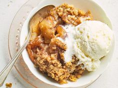 an apple crisp with ice cream in a bowl