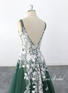 a green and white dress with flowers on it