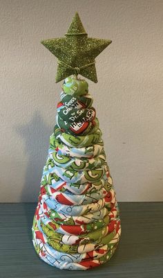 a christmas tree made out of cloth with a star on top