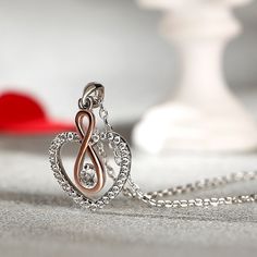 Whether you are looking for something special for your mother or wife, this infinity heart necklace is a lovely way to show her how much you treasure her. The infinity necklace was designed as a symbol of endless and enduring love, memories, and devotion that is unbreakable. The design of this necklace combines the beating heart, meaning that my heart only beats for you. Perfect to pair with nearly everything in her closet, it will bring a smile to her face every time she puts it on.Carat Weight Infinity Jewelry For Valentine's Day Gift For Mom, Infinity-shaped Jewelry For Mom For Valentine's Day, Elegant Double Heart Necklace Gift For Mom, Valentine's Day Infinity Jewelry Gift For Mom, Infinity Necklace For Mom On Valentine's Day, Rose Gold Heart Necklace With Clavicle Chain For Anniversary, Infinity Necklace For Anniversary Gift, Rose Gold Infinity Necklace For Anniversary, Elegant Rose Gold Heart Necklace For Mom