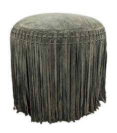 a large round ottoman with fringes on it's legs and the top part of its