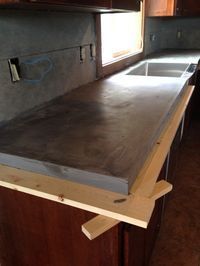 the counter top is being installed in the kitchen