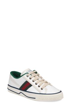 Gucci serves up some heritage style with a low-top sneaker branded with Web striping, double-G sole embossing and retro sport labels at the tongue and footbed. Style Name:Gucci Tennis 1977 Platform Sneaker (Women). Style Number: 6002528. Available in stores. Gucci Sporty Sneakers With Logo Detail, Sporty Gucci Sneakers With Logo Detail, Gucci Lace-up High-top Sneakers With Logo Detail, Gucci High-top Lace-up Sneakers With Logo, Gucci Low-top Sneakers With Logo Detail, White Designer Canvas Sneakers, Designer White Canvas Sneakers, Gucci Sporty High-top Sneakers With Embroidered Logo, White Gucci Sneakers With Logo Detail