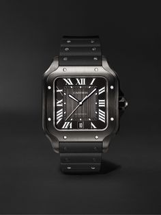 Launched more than 100 years ago as one of the first ever wristwatches, Cartier's 'Santos' reference is truly iconic. This stealthy all-black version is crafted from steel and ADLC and powered by a precise automatic caliber 1847 MC movement. It has a sleek black dial with luminescent sword-shaped hands and a matching alligator strap along with a 'QuickSwitch' interchangeable rubber strap for more casual occasions. We offer a two-year warranty for all working parts and manufacturing faults for lu Cartier Gold Watch, Cartier Santos Watch, Cartier Roadster, Luxury Gifts For Men, Changing The World, Latest Watches, Cartier Santos, Gold Watch Men