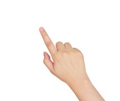 a person's hand is pointing to the left with their index finger in the air