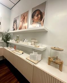 a room with shelves and pictures on the wall