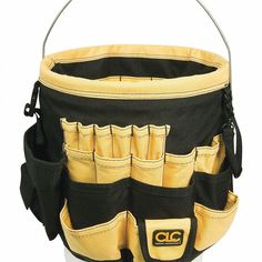 a large black and yellow tool bag with multiple pockets on the inside that hold tools