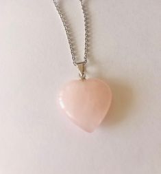 A beautiful rose quartz pendant necklace has a polished heart shaped pendant on a silver mounting free floating on a sterling silver cable chain. The stone has a pink color and catches the light just right. This necklace makes a perfect gift for your special someone. It is definitely a 5 star necklace. Materials This pendant is a natural polished heart shaped rose quartz stone. Each stone is unique and will vary slightly in size and looks! Each stone is gorgeous The measurement of this pendant i Pink Gemstone Heart Necklace Gift, Pink Gemstone Heart Necklace For Gift, Pink Heart Gemstone Necklace For Gift, Pink Heart Gemstone Pendant Necklace, Pink Pendant Crystal Necklaces For Valentine's Day, Pink Gemstone Heart Necklace, Silver Rose Quartz Heart Jewelry, Silver Heart-shaped Rose Quartz Jewelry, Rose Quartz Heart Pendant Necklace With Charm