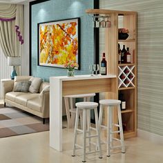 a living room filled with furniture and a painting hanging on the wall over a bar