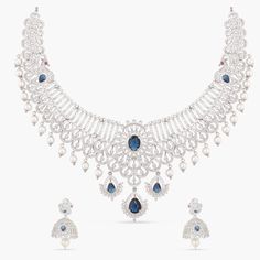 Description: This Nakshatra CZ necklace set is the perfect addition to your traditional wardrobe. Combining exquisite peacock and floral motifs with high-quality CZ stones and freshwater pearl drops, this elegant jewelry is sure to make a lasting impression. Whether it's family gatherings or special occasions, you're sure to shine in this timeless piece that celebrates Indian culture. Details & Specifications: Materials used: CZ stones with White Gold Plating Weight -Necklace: 68.14 gms, Earring Traditional Wardrobe, Indian Culture, Cz Necklace, Yellow Gold Engagement Rings, Floral Motifs, Gold Engagement, Custom Necklace, Family Gatherings, Elegant Jewelry