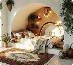 a bedroom with a bed, rugs and potted plants in the corner next to it