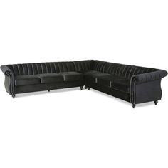 a black velvet sectional sofa with chrome legs and studded trims on the back