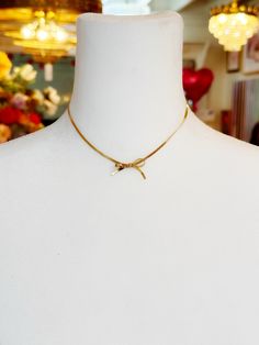 Your quiet courage becomes you. You quietly cultivate your soul AND courageously create your reality. Just like this delicate gold bow hung on gold snake chain, you are simultaneously soft and strong. Length: 13" to 15" “I LOVE IT WITH MY WHOLE HEART” GUARANTEE: In our jewelry, we use 14k gold filled, sterling silver, and solid brass as well as vintage components that have stood the test of time! These antique components are of high quality and have lasted for many decades - many even centuries! Minimalist Gold Jewelry With Bow, Dainty Gold Jewelry With Ribbon, Gold Ribbon Necklace For Wedding, Create Your Reality, Unique Bridal Jewelry, Big Statement Earrings, Glam Earrings, My One And Only, Gold Snake Chain