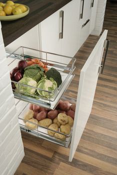 two glass containers filled with food on top of a kitchen counter next to a wooden floor