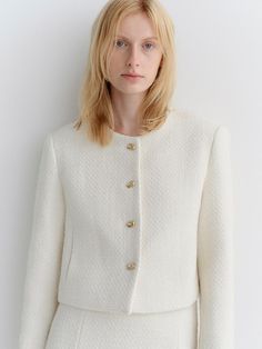 This is a modern and feminine tweed jacket by ARCHAIC that is made out of high quality and sturdy material. With distinctive mood of the design and comfortable wear, you can style it for your modern daily outfit.- Clean and minimal silhouette- Classic gold color buttons on the front- Set up with matching skirt Elegant Tweed Jacket With Button Cuffs, Elegant Tweed Outerwear With Button Cuffs, Chic Tweed Blazer With Button Cuffs, Chic Wool Tweed Jacket With Hidden Buttons, Chic Wool Tweed Jacket With Hidden Button Closure, White Tweed Jacket With Button Closure, White Wool Tweed Jacket In Chic Style, Chic Wool Tweed Jacket With Buttons, Chic White Wool Tweed Jacket