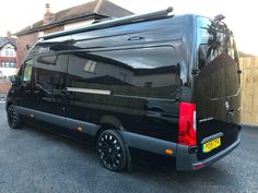 a black van parked in a parking lot