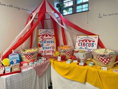 a circus themed birthday party with popcorn and snacks on the table in front of it