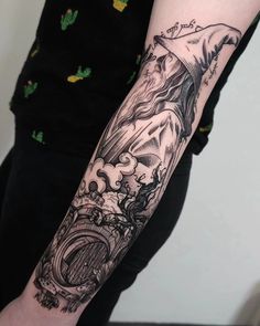 a woman with a tattoo on her arm