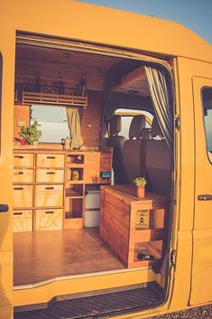 the interior of a van with drawers and storage