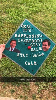 someone is holding up a graduation cap with the words, okay it's happening everybody stay calm and calm